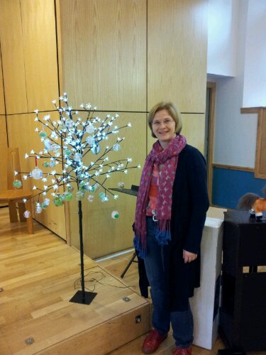 Shona Adam standing in front of our Christmas card tree