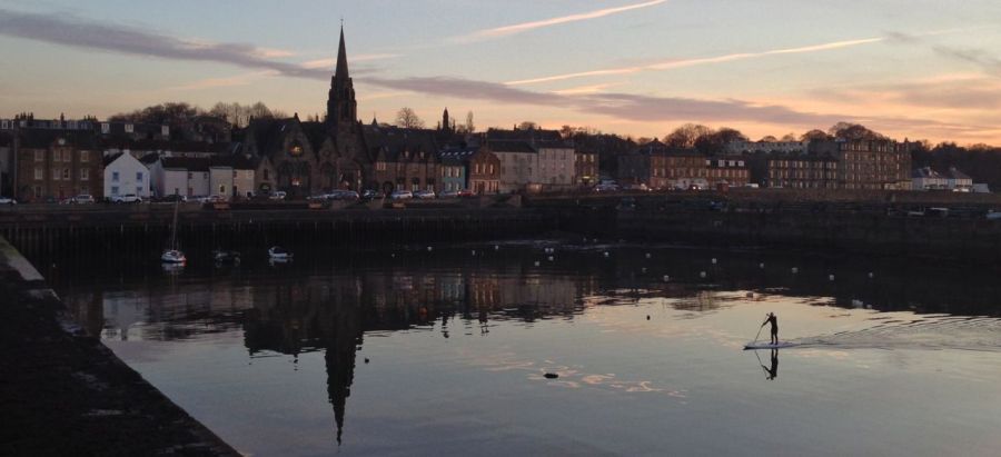Paddle-boarder in Newhaven Harbour